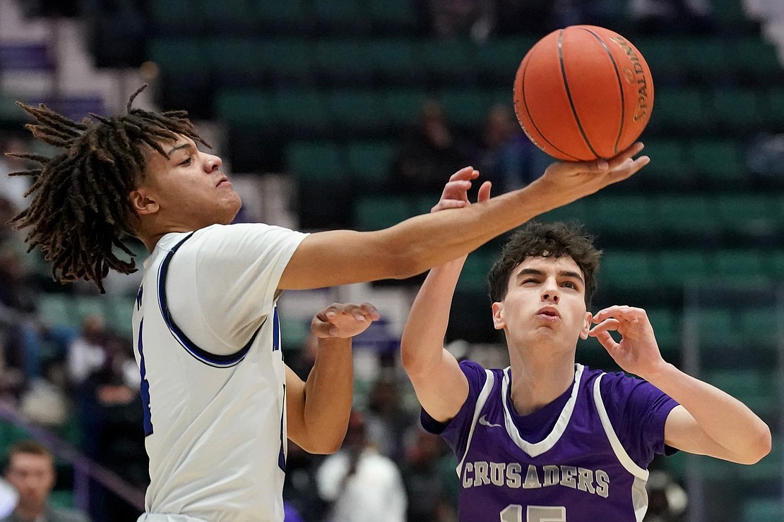 Catholic Central’s Nick Riley fights for control of the ball with Weshill’s Kameron Langdon during their State Class B final basketball game on Sunday March 19, 2023, at Cool Insuring Arena in Glens Falls, N.Y. Westhill wins 66-61.  Cindy Schultz for The Evangelist