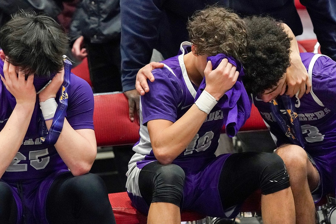 Catholic Central’s Brian Warncke, left, Xavyjon Arroyo, center, and Aiden Prunty take in their 66-61 loss to Westhill in their State Class B final basketball game on Sunday March 19, 2023, at Cool Insuring Arena in Glens Falls, N.Y.  Cindy Schultz for The Evangelist