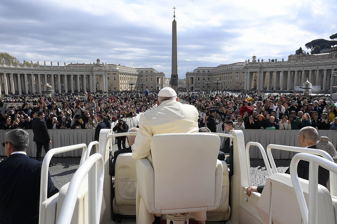 Pope Francis rides in the popemobile in St. Peter's Square at the Vatican during his weekly general audience April 5, 2023. (CNS photo/Vatican Media)