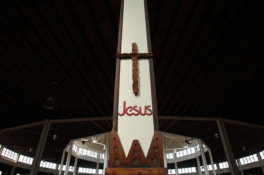 A file photo shows a cross and Jesus' name on a pillar in the church at Our Lady of Martyrs Shrine in Auriesville, N.Y. As part of the National Eucharistic Revival, the New York bishops are hosting a state-wide Eucharistic Congress Oct. 20-22, 2023, at the shrine. (OSV News photo/CNS file, Nancy Wiechec)