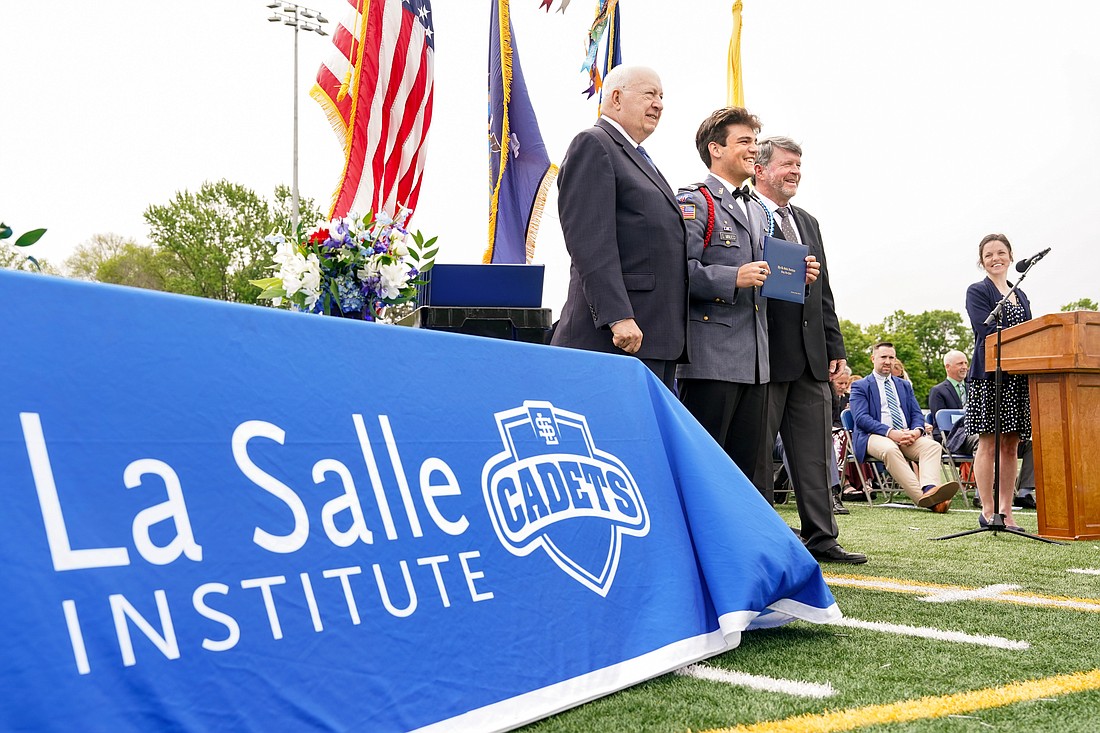 Graduate Salvatore Minucci, center, poses for a picture with President Joseph B. Raczkowski, left, and Gen. Mark O’Neil during commencement exercises on Saturday May 20, 2023, at La Salle Institute in Troy, N.Y.  Cindy Schultz for The Evangelist