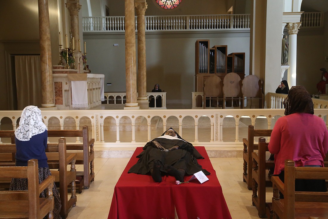 The exhumed body of Sister Mary Wilhelmina Lancaster, foundress of the Benedictines of Mary, Queen of Apostles, lies in repose in the church at the Abbey of Our Lady of Ephesus in Gower, Mo., May 21, 2023. (OSV News photo/Megan Marley)