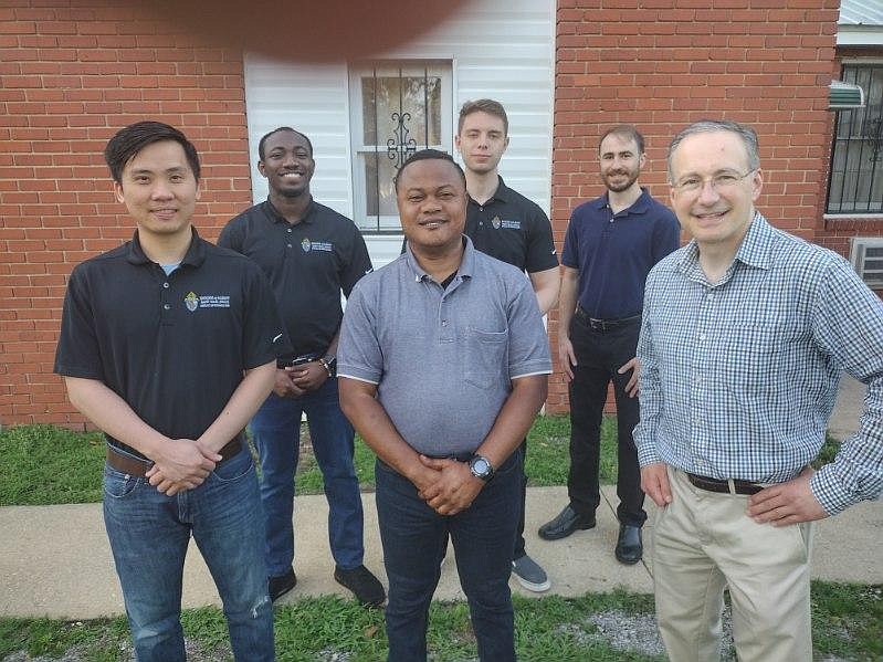 Diocesan seminarians Joseph Hien Pham (front row from l.), Arnold Pyram, Tom Fallati, Zephryinus Ogbenna (back row from l.), Robert Cieply and Anthony Leo are spending the summer in and around Selma, Ala., helping the rural poor through the Edmundite Missions. (Photo provided)