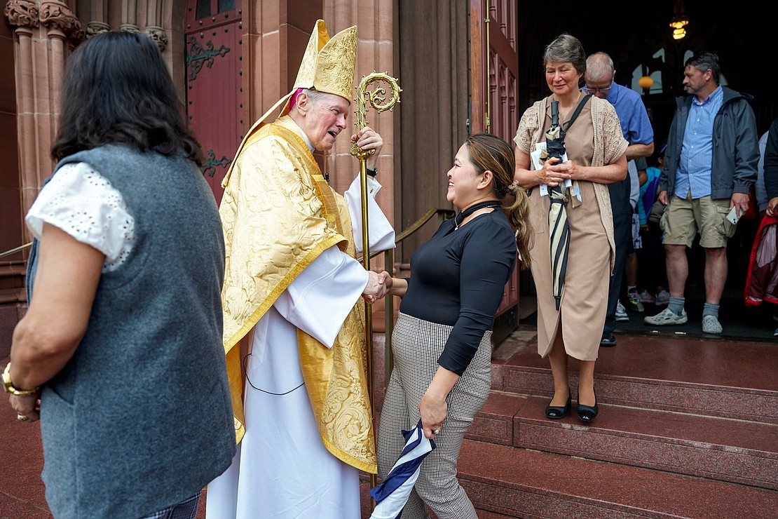 Bishop Edward B. Scharfenberger greets parishioners after a Mass that honored his 50 years in the priesthood on Sunday, July 2 at the Cathedral of Immaculate Conception in Albany.  Cindy Schultz for The Evangelist
