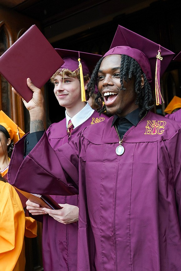 Graduates Tanner Litts, left, and Ja’Quare Jones celebrate following Notre Dame-Bishop Gibbons commencement exercises on Saturday, June 24, 2023, at St. John the Evangelist in Schenectady, N.Y.  Cindy Schultz for The Evangelist