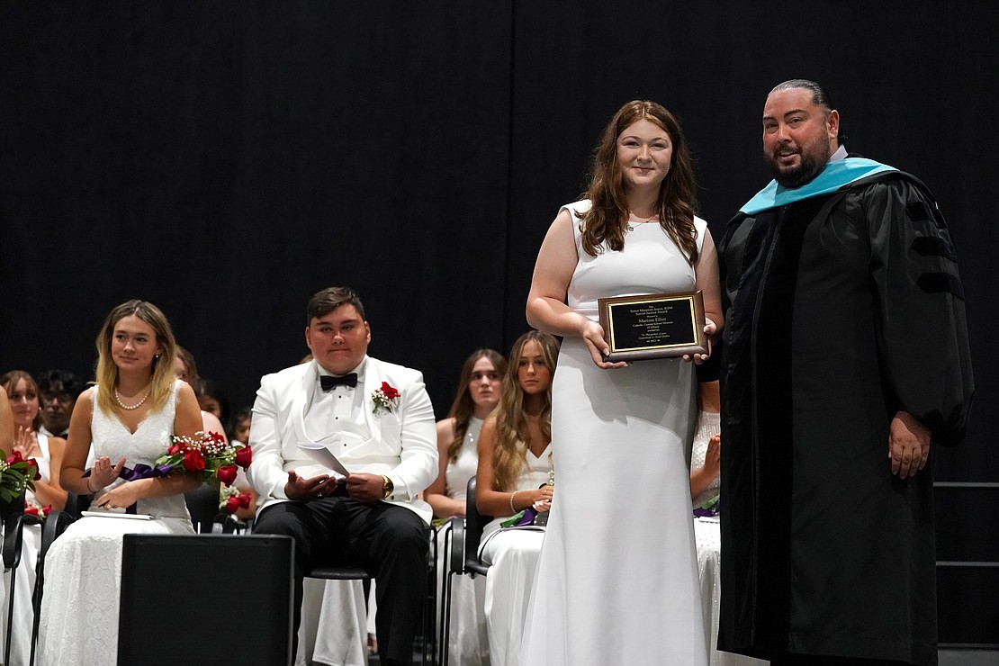 Graduate Marissa Elliott, second from right, recipient of the sister Maureen Joyce Social Justice Award, poses for a photo with superintendent of schools Giovanni Virgiglio Jr. during Central Catholic commencement exercises on Saturday, June 24, 2023, at Hudson Valley Community College in Troy, N.Y.  Cindy Schultz for The Evangelist