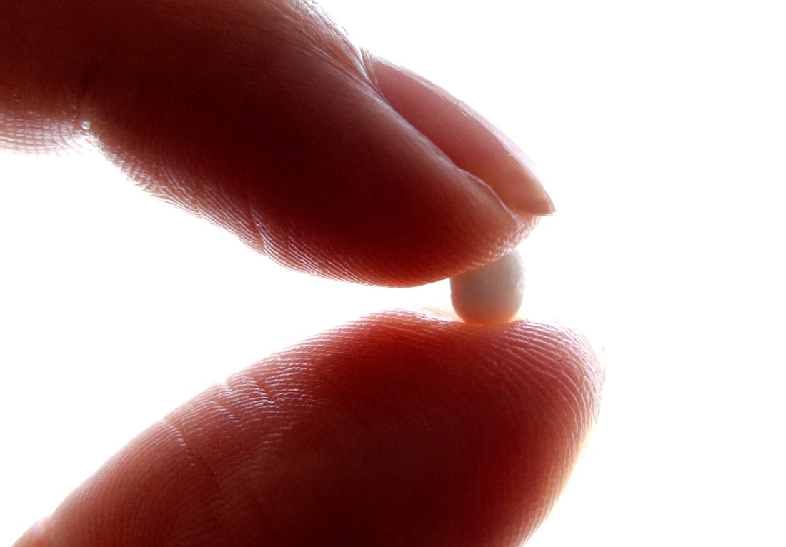 A woman holds a birth control pill in this photo illustration. The Food and Drug Administration announced July 13, 2023, it approved the sale of a birth control pill without a prescription for the first time in the United States -- a move that will increase the availability of oral contraception and impact ongoing debates about abortion policy post-Dobbs. (OSV News photo photo/Eric Gaillard, Reuters)