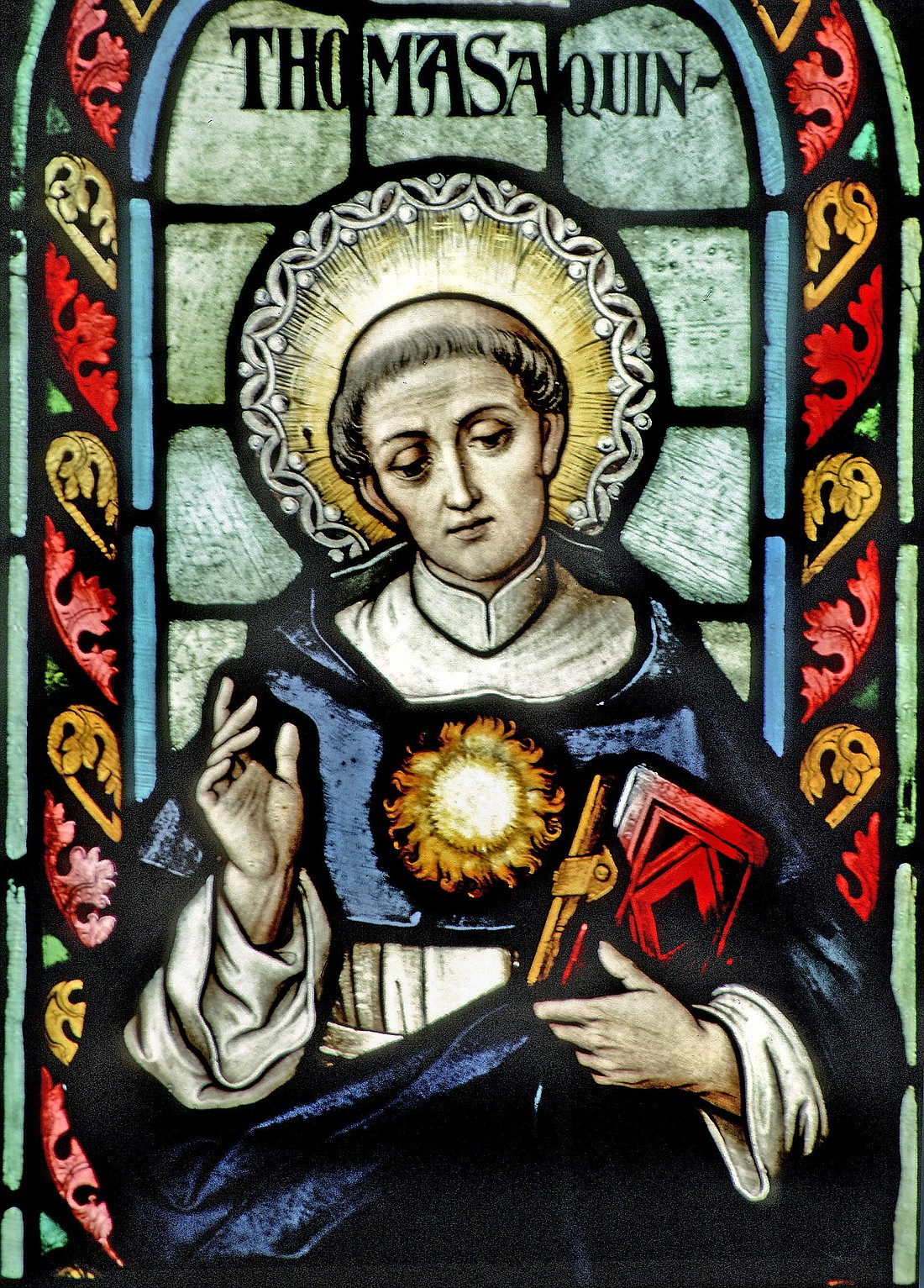 St. Thomas Aquinas is seen in stained glass at the Basilica of Our Lady of the Immaculate Conception in Guelph, Ontario. (CNS photo/Gene Plaisted, The Crosiers) See THOMISTIC-INSTITUTE-ONLINE-SERIES Aug. 22, 2019.