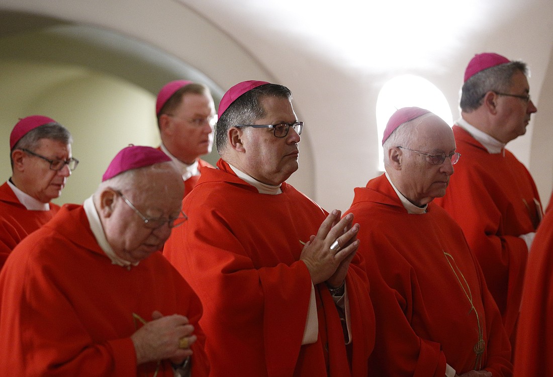 Bishop Douglas J. Lucia of Syracuse, center, and other U.S. bishops from the state of New York concelebrate Mass in the crypt of St. Peter's Basilica at the Vatican Nov. 14, 2019, during their "ad limina" visits to the Vatican to report on the status of their dioceses to the pope and Vatican officials. (CNS photo/Paul Haring)