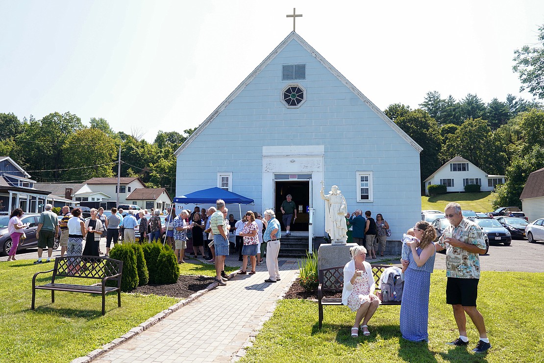 Parishioners enjoy community time that includes beverages and sweets following mass on Sunday, July 23, 2023, at St. Isaac Jogues Chapel, which is open from Memorial Day “til the snow flies,” in Saratoga Springs, N.Y.  Cindy Schultz for The Evangelist
