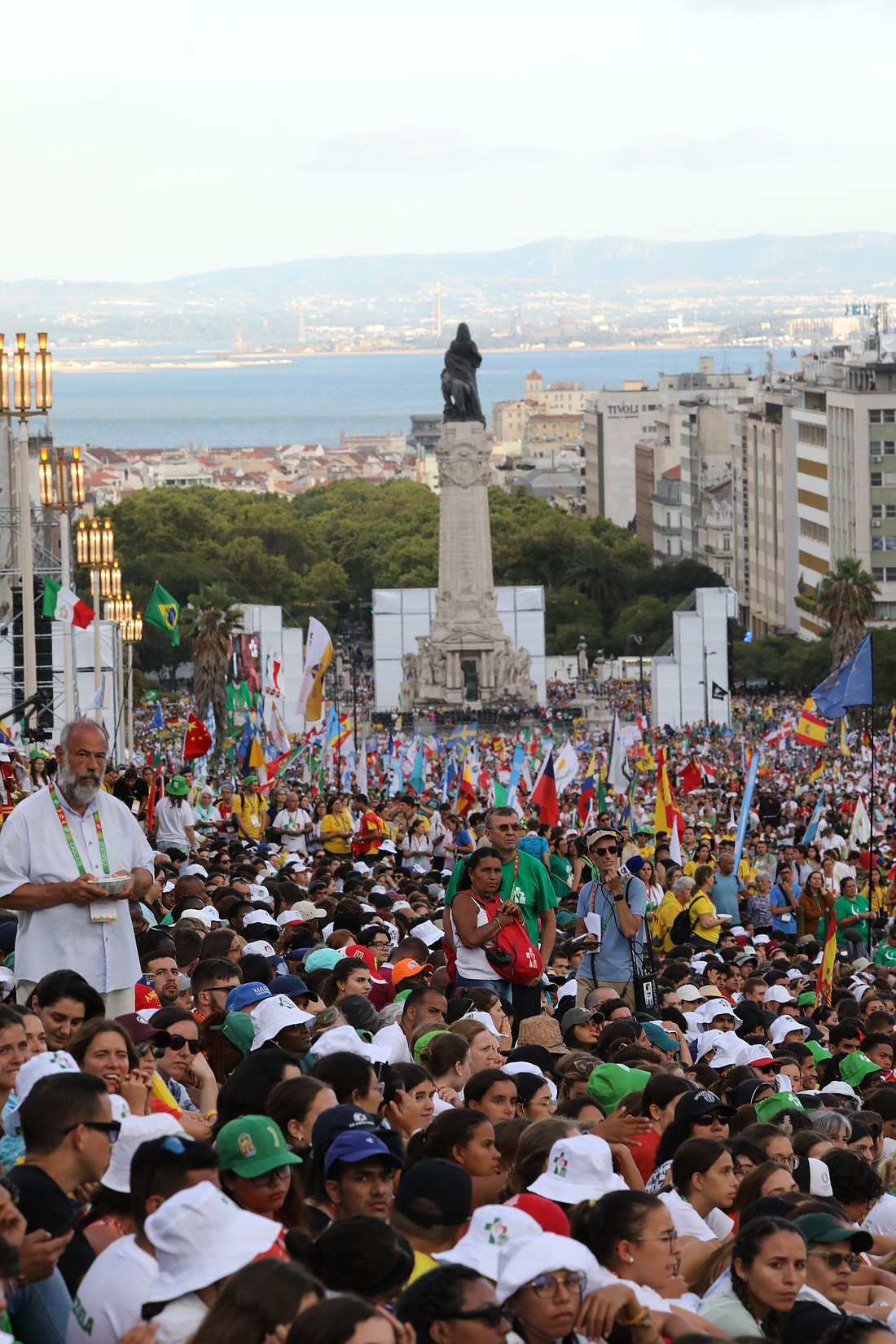 Pilgrims gather prior to the opening Mass for World Youth Day at Eduardo VII Park in Lisbon, Portugal, Aug. 1, 2023. (OSV News photo/Bob Roller)