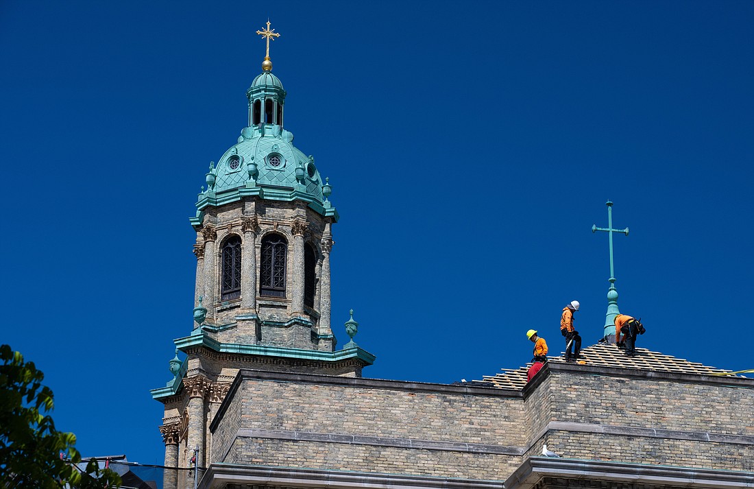 Construction workers replace the tile roof of the Cathedral of St. John the Evangelist in Milwaukee May 27, 2023. Labor Day, a federal holiday in the United States is celebrated on Monday, Sept. 4. The observance honors the American labor movement and the works and contributions of laborers in the United States. (OSV News photo/Sam Lucero)