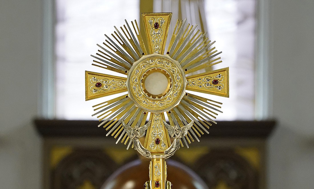 A monstrance containing the Blessed Sacrament is displayed on the altar during Eucharistic adoration at Notre Dame Church in New Hyde Park, N.Y., July 25, 2023. (OSV News photo/Gregory A. Shemitz)