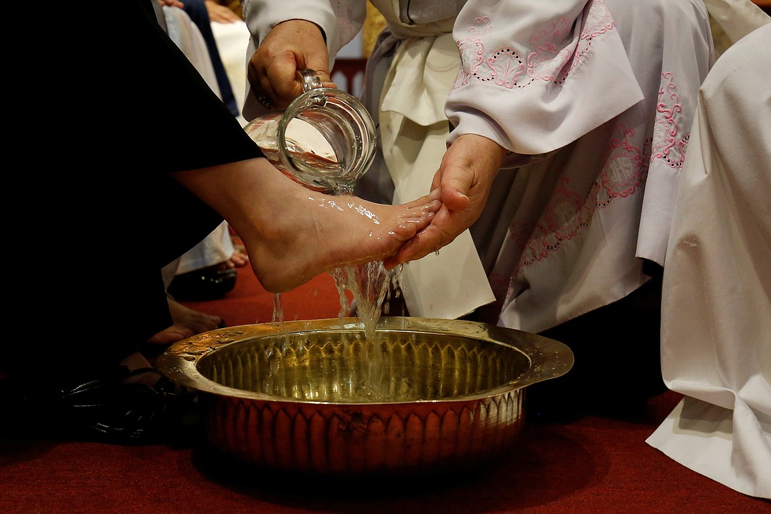 The theme for this year’s Catechetical Sunday - “Come to me, all you who labor and are burdened” - is captured beautifully by the image of Pope Francis washing and kissing the feet of the poor and marginalized on Holy Thursday. (OSV file photo)