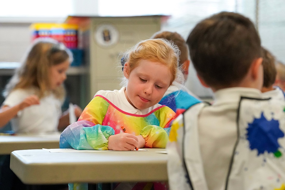 Grace colors with her kindergarten classmates during art class on Sept. 12 at St. Clement's School in Saratoga Springs. Cindy Schultz photo for The Evangelist