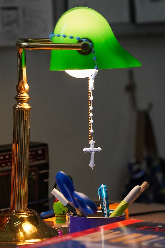 A rosary hangs from a desk lamp in the Global History classroom on Sept. 13 at Saratoga Central Catholic School in Saratoga Springs. Cindy Schultz photo for The Evangelist