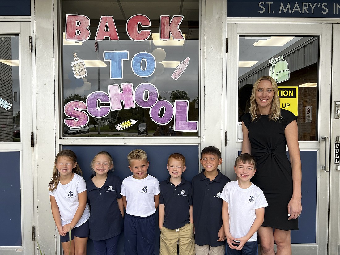 Kayla Bills, principal of St. Mary's Institute in Amsterdam, welcomes back students on their first day of school. Bills is one of three principals in the Albany Diocese who are leading schools they previously taught at. (Provided photo)