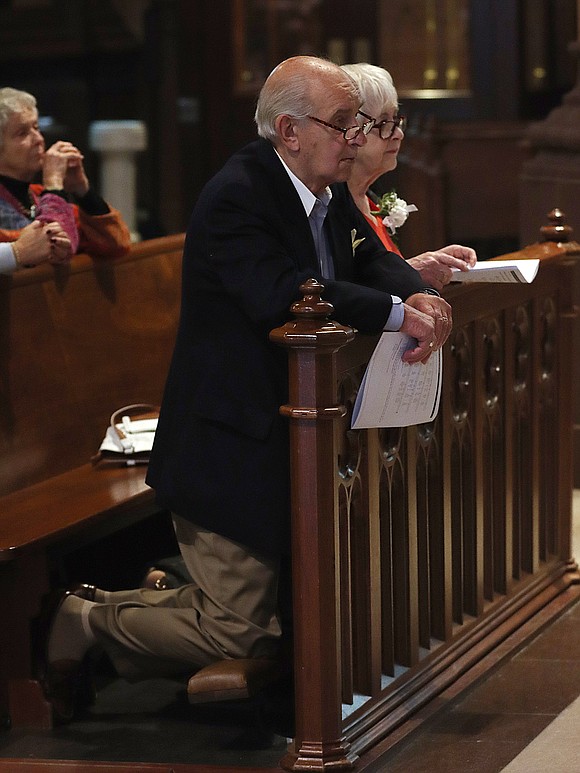 Vincent and Sheila Giordano, married 50 years, kneel during the 51st Annual Diocesan Marriage Jubilee Celebration on Sept. 23 at the Cathedral of the Immaculate Conception. (Thomas Killips photo)