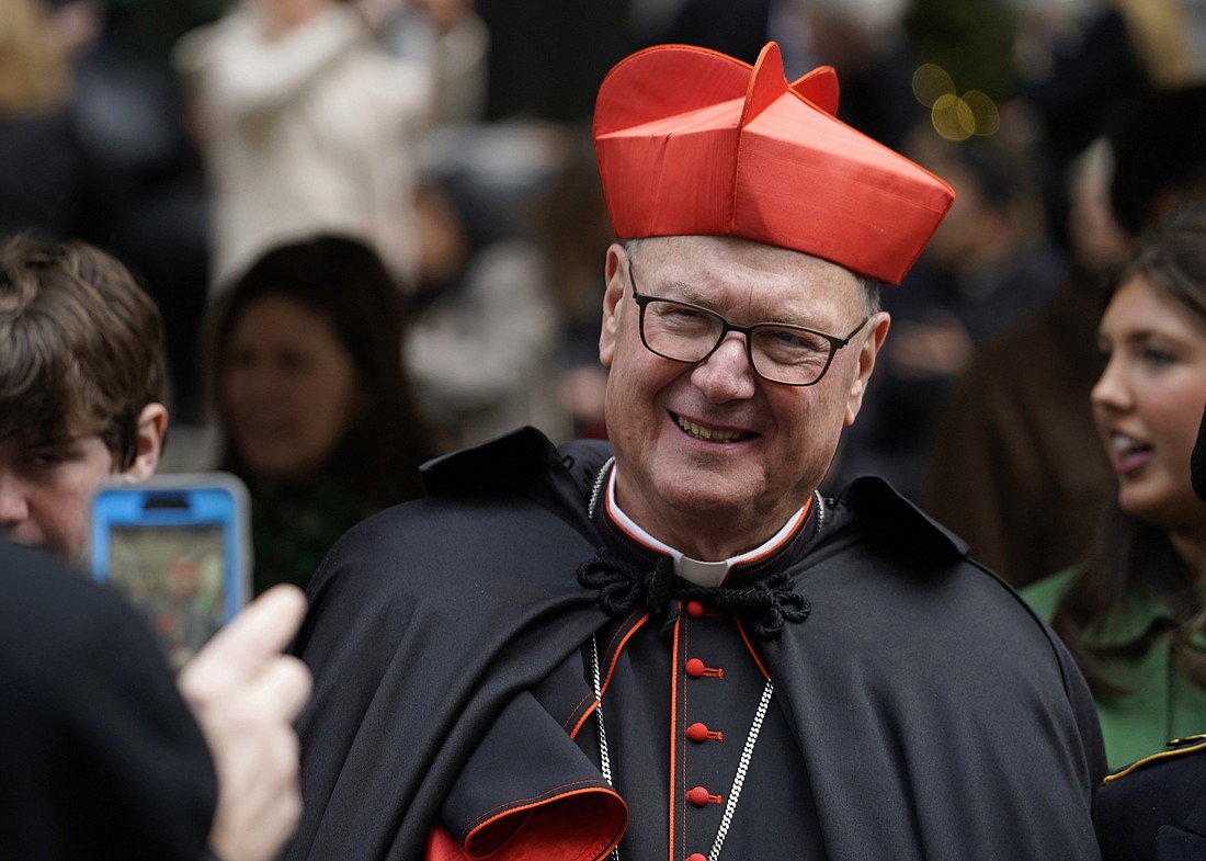 New York Cardinal Timothy M. Dolan smiles outside St. Patrick’s Cathedral as he reviews the St. Patrick's Day Parade in New York City March 17, 2023. (OSV News photo/Gregory A. Shemitz)