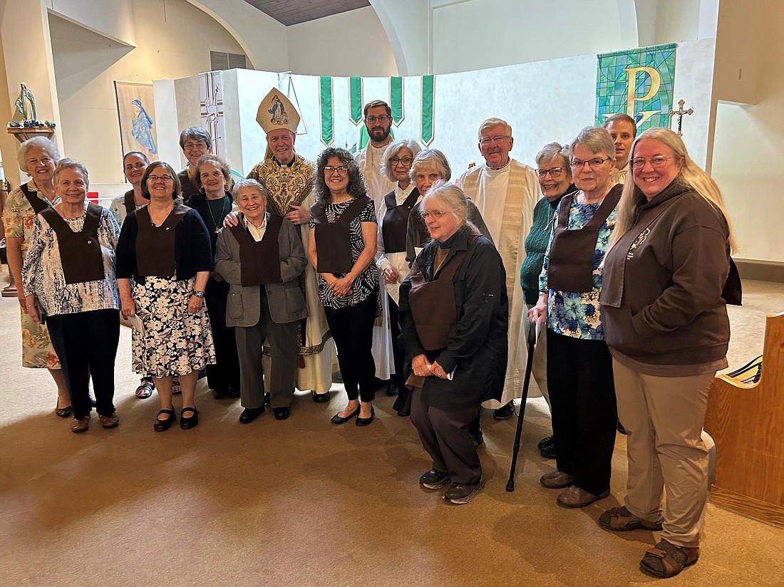 Bishop Edward B. Scharfenberger is shown with members of the Our Lady of Mercy Community of Secular Discalced Carmelites after a Mass honoring the group’s 70th anniversary. (Photo provided)