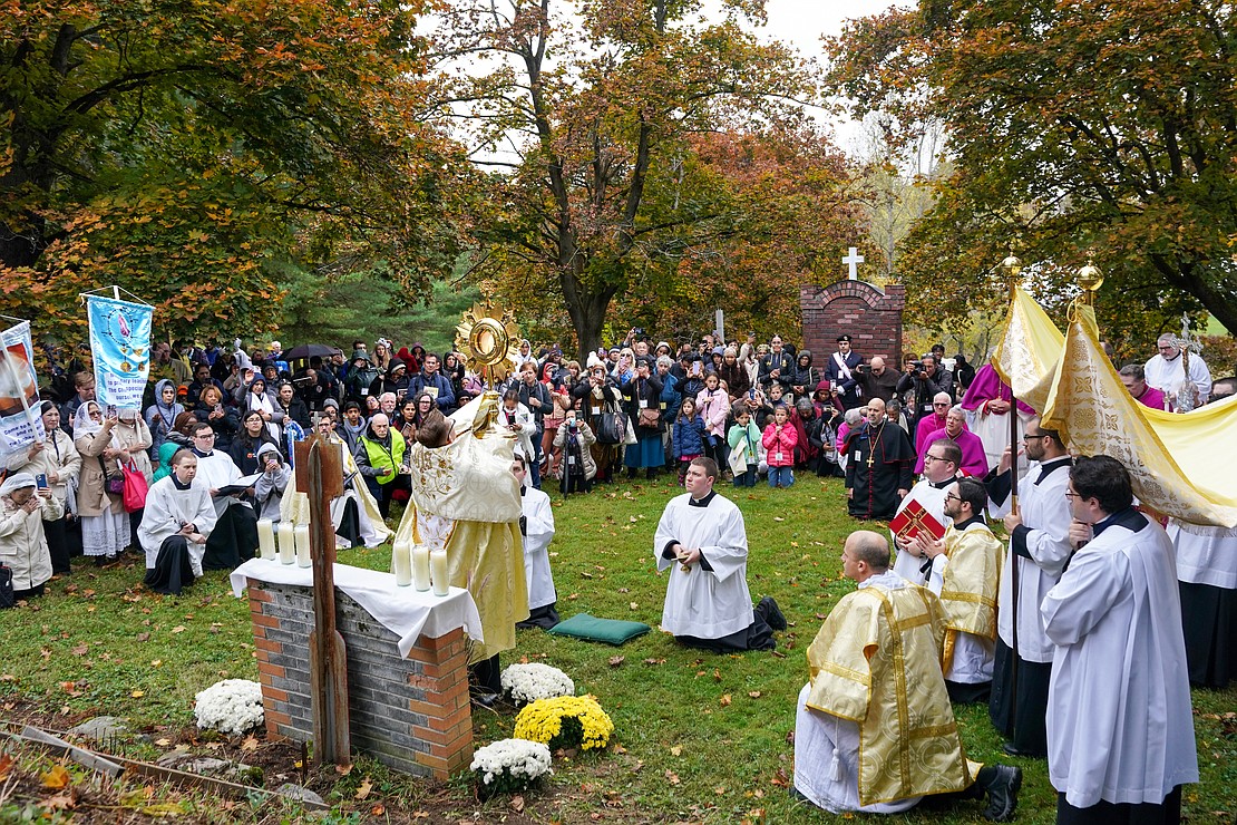 The Monstrance is lifted for all to adore at a stop on the Eucharistic Procession during the Eucharistic Congress on Saturday, Oct. 21, 2023, at Our Lady of Martyrs Shrine in Auriesville, N.Y.  Cindy Schultz for The Evangelist
