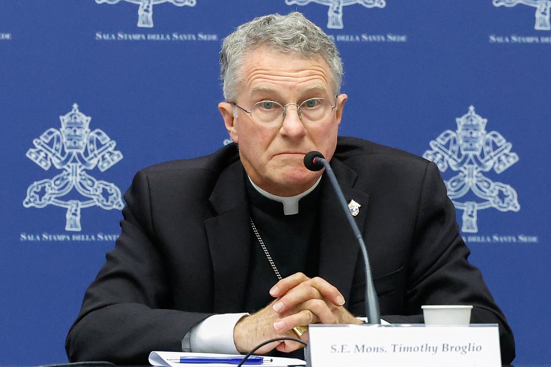 Archbishop Timothy P. Broglio of the U.S. Archdiocese for the Military Services, president of the U.S. Conference of Catholic Bishops, listen interventions from other cardinals during a briefing about the assembly of the Synod of Bishops at the Vatican Oct. 25, 2023. (CNS photo/Lola Gomez)