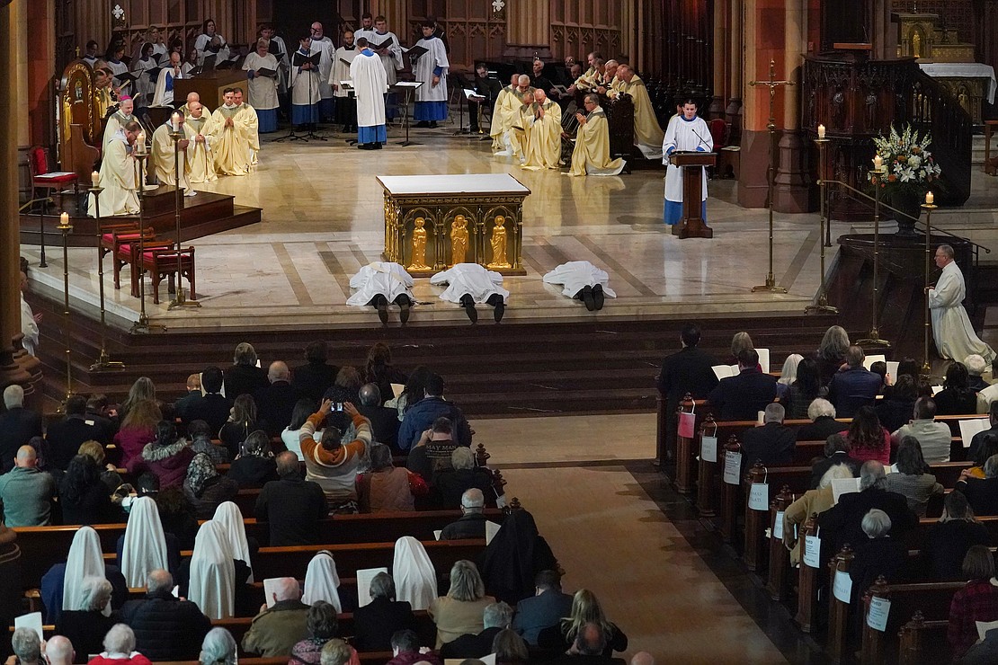Candidates for deacon and priest supplicant themselves before the altar during the Litany of Supplication during their ordination on Saturday Nov. 18, 2023, at the Cathedral of Immaculate Conception in Albany, N.Y. (Cindy Schultz photo for The Evangelist)