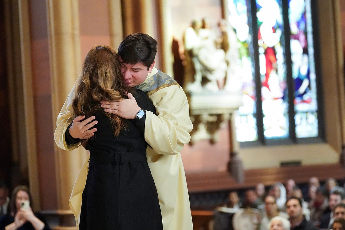 Father Daniel Vallejo embraces his sister, Natalia Vallejo Rios, after he’s vested during his Ordination Mass on Nov. 18 at the Cathedral of the Immaculate Conception in Albany. (Cindy Schultz photo for The Evangelist)