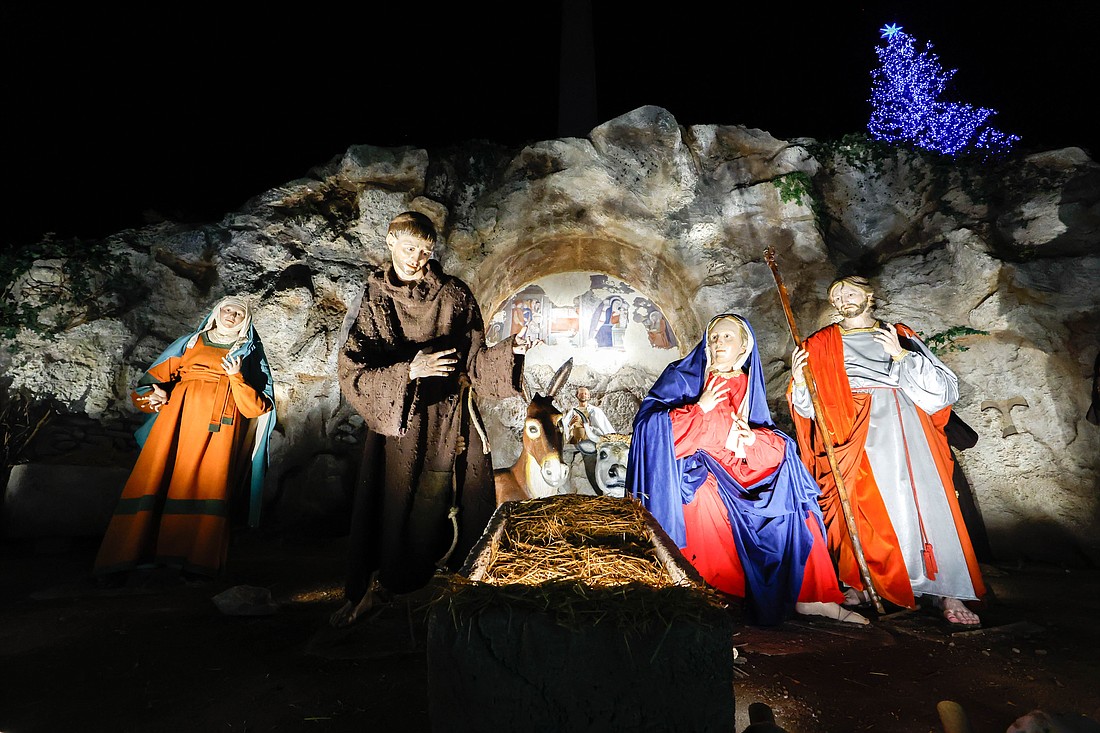 The Nativity scene is revealed and Christmas tree is lighted in St. Peter’s Square at the Vatican Dec. 9, 2023. The creche is a reproduction of the scene in Greccio, Italy, where St. Francis of Assisi staged the first Nativity scene in 1223. The baby Jesus will be placed in the manger Dec. 24. (CNS photo/Lola Gomez)