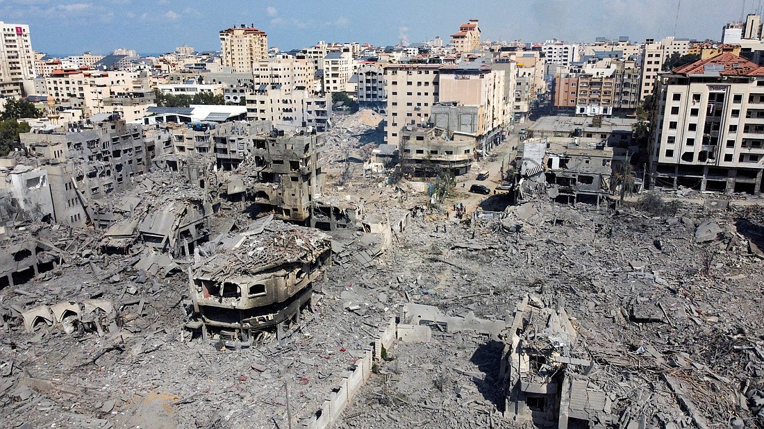 Buildings destroyed by Israeli airstrikes are seen in Gaza City Oct. 10, 2023. Israel launched the airstrikes in retaliation for the assault on the country by Hamas. The war so far has claimed more than 2,000 lives. (OSV News photo/Mohammed Salem, Reuters)