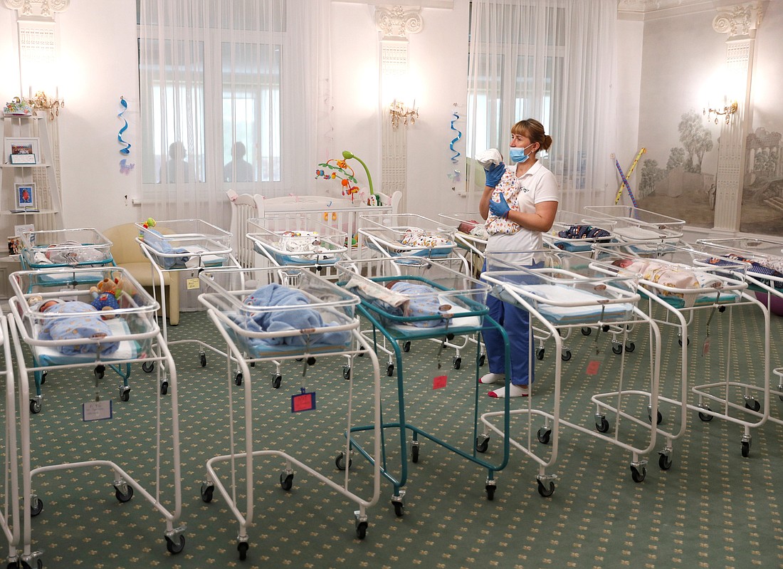 A nurse and newborns are seen in the Hotel Venice in Kyiv, Ukraine, May 14, 2020, which is owned by BioTexCom, a surrogacy agency. Pope Francis told diplomats Jan. 8, 2024, that he finds surrogacy "deplorable" and would like to see the practice universally banned. (OSV News photo/Gleb Garanich, Reuters)