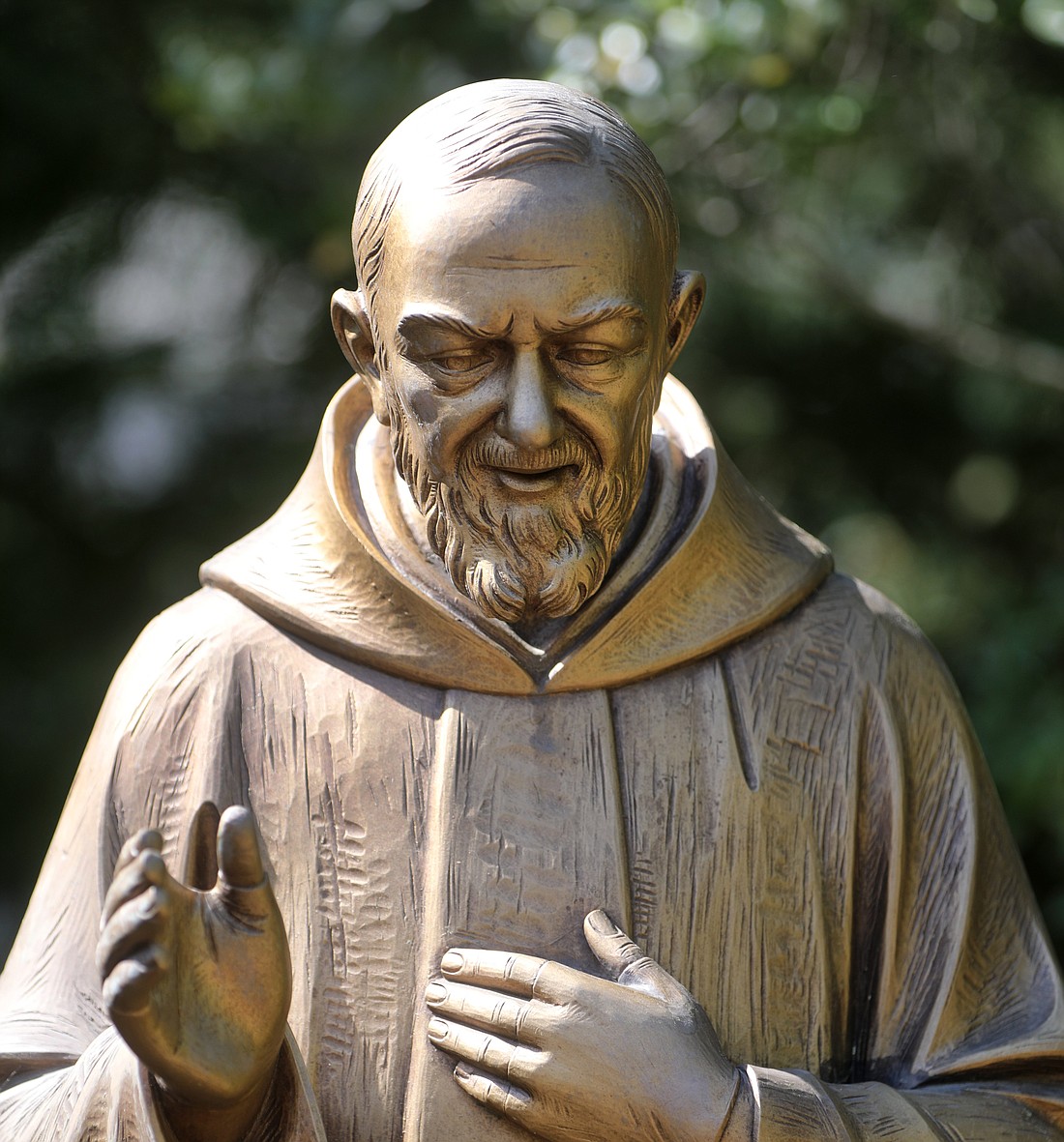 A statue of St. Pio of Pietrelcina is displayed in the garden at Jesus the Good Shepherd Church in Dunkirk, Md., April 28, 2022. (OSV News photo/Bob Roller)