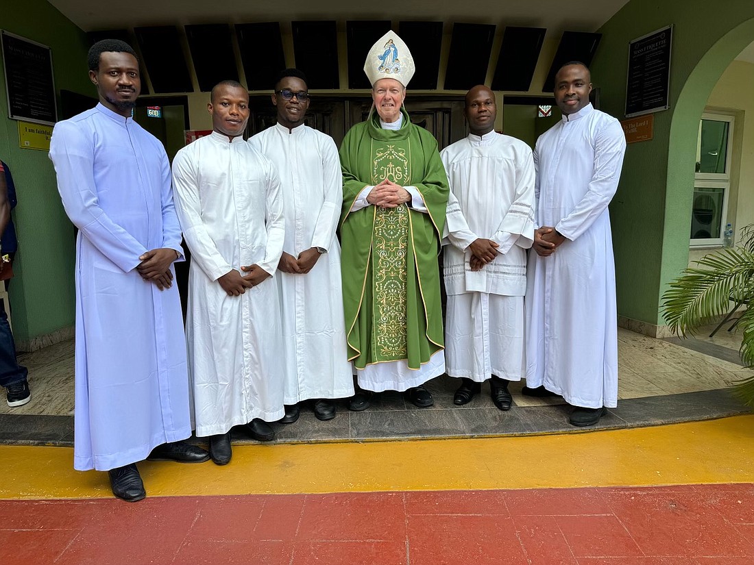 The diocesan aspirants in Nigeria are shown with Bishop Edward B. Scharfenberger last week. They are studying under the guidance of Father Vitus Unegbu, SC, at the Philosophical and Theological Formation House of the Congregation of the Servants of Charity in Ibadan, Nigeria. (Photo provided)
