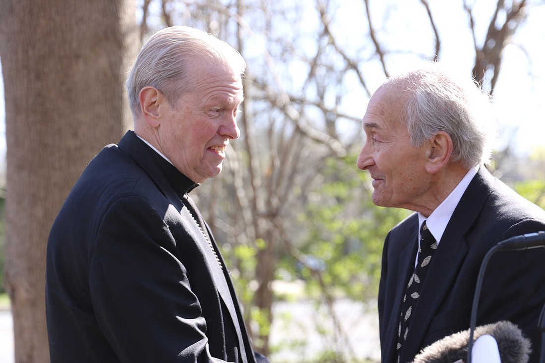 BISHOP EDWARD B. SCHARFENBERGER (l.) talks with Dr. Michael Lozman during the Day of Remembrance on April 28, 2022, at the future site of the Capital District Jewish Holocaust Memorial off Troy Schenectady Road in Niskayuna. (Evangelist file photo)
