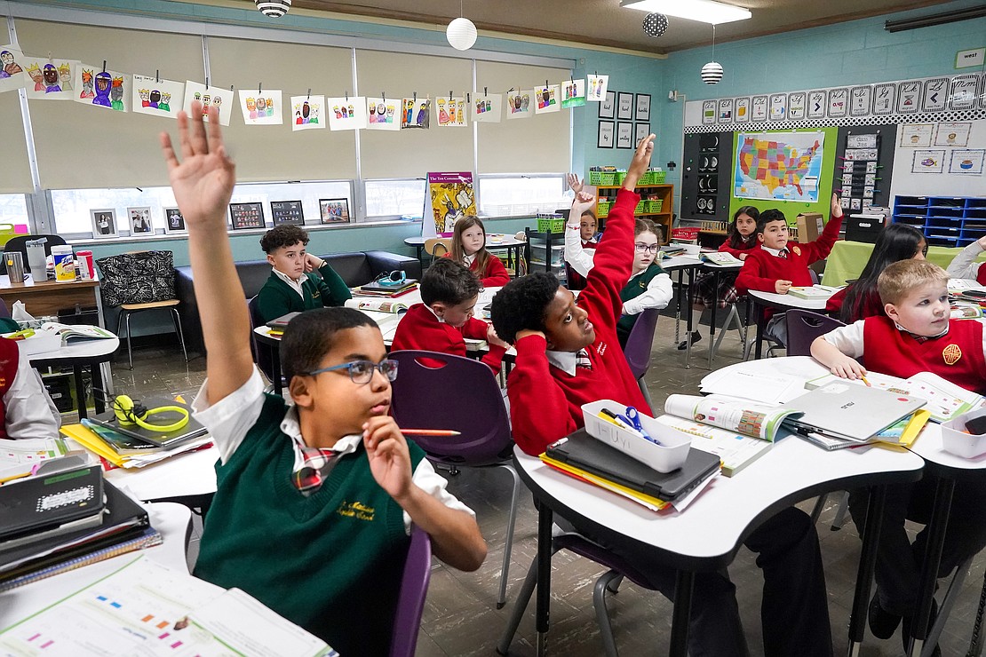 The fourth-grade class works on math at St. Madeleine Sophie School. (Cindy Schultz photo for The Evangelist)