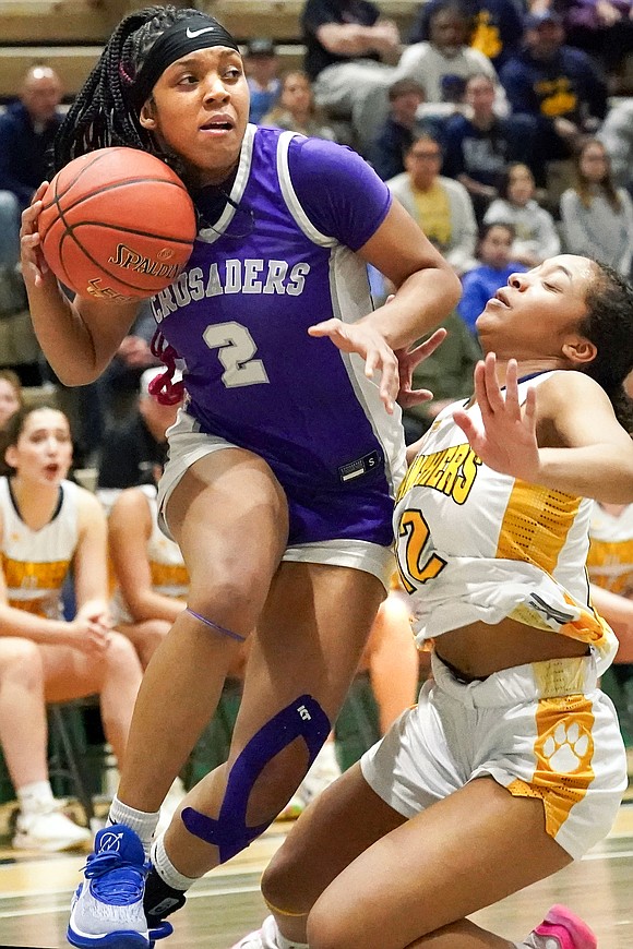 Catholic Central’s Tanavia Turpin, left, bumps Walter Panas’ Cadence Nicholas on her way to the hoop during their Class A state final basketball game on Saturday, March 16, 2024, at Hudson Valley Community College in Troy, N.Y.  Cindy Schultz for The Evangelist