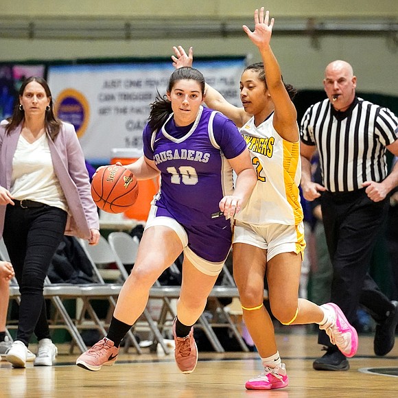 Catholic Central’s Kristen Foglia, center, drives up court as Walter Panas’ Cadence Nicholas defends during their Class A state final basketball game on Saturday, March 16, 2024, at Hudson Valley Community College in Troy, N.Y.  Cindy Schultz for The Evangelist