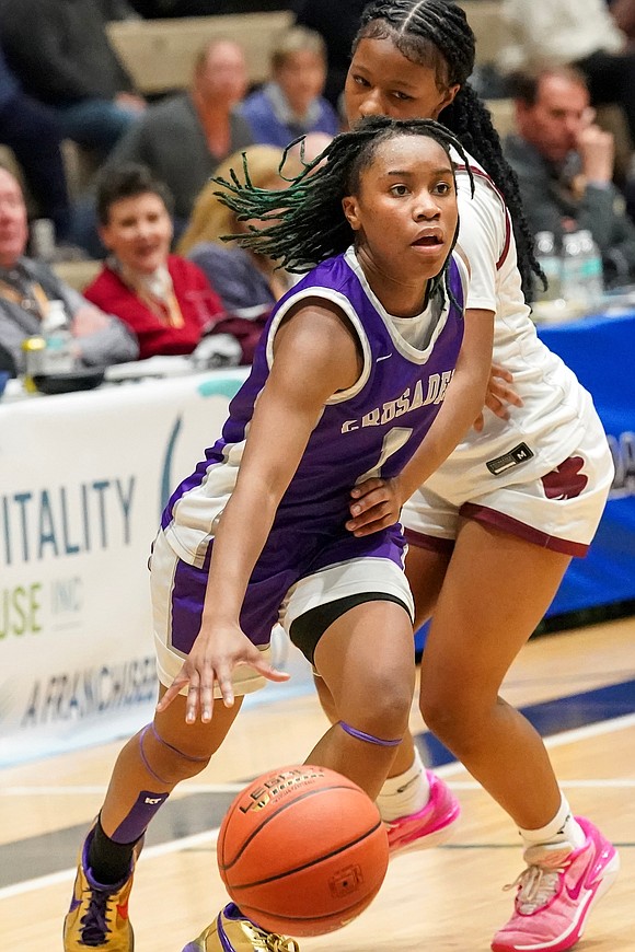Catholic Central’s El’Dior Dobere drives to the hoop as Aquinas Institute’s Carle Thomas defends during in their Class A semifinal basketball game on Friday, March 15, 2024, at Hudson Valley Community College in Troy, N.Y. CCS wins 63-46.  Cindy Schultz for The Evangelist
