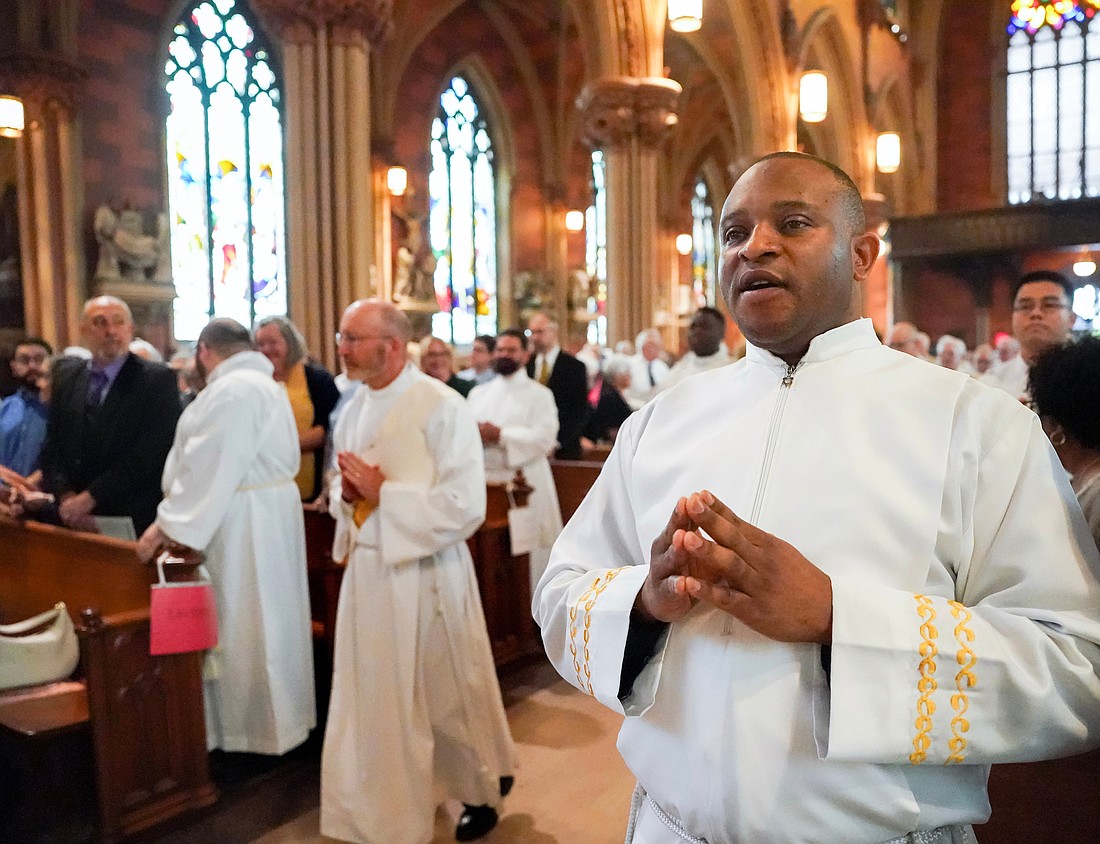 Deacon Anthony Chibueze Onu (r.) is shown during his Ordination to the Diaconate on May 20, 2023 at the Cathedral of Immaculate Conception in Albany, and in a more recent photo (below) from his time at seminary. (Cindy Schultz photo for The Evangelist/photo provided)