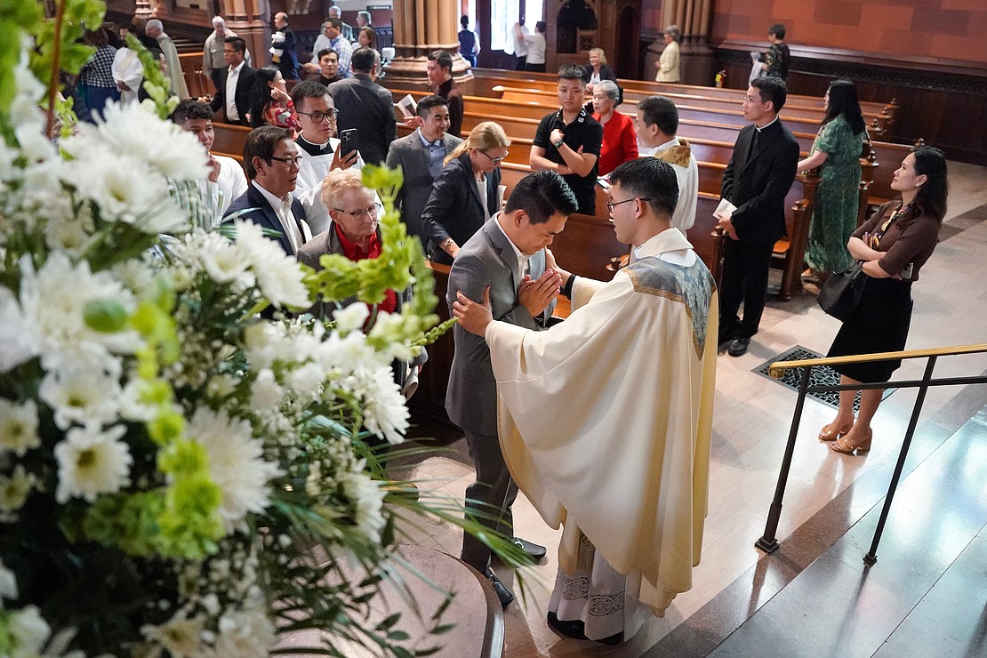Newly ordained priest Joseph Tuan Van Pham, center, blesses parishioners following the Ordination of Priests on Saturday May 18, 2022, at the Cathedral of Immaculate Conception in Albany, N.Y.  Cindy Schultz for The Evangelist