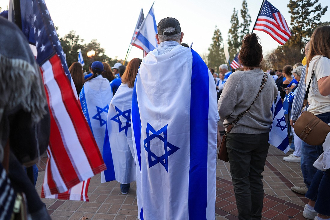People wear Israeli flags as they participate in a United for Israel March at the University of Southern California in Los Angeles May 8, 2024, during the ongoing war in the Gaza Strip between Israel and Gaza's ruling Palestinian Islamist militant group Hamas. (OSV News photo/David Swanson, Reuters)