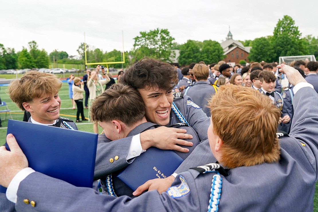 Graduate Tyler Sousa, center, celebrates with classmates after their commencement exercises on Saturday May 18, 2024, at La Salle Institute in Troy, N.Y.  Cindy Schultz for The Evangelist