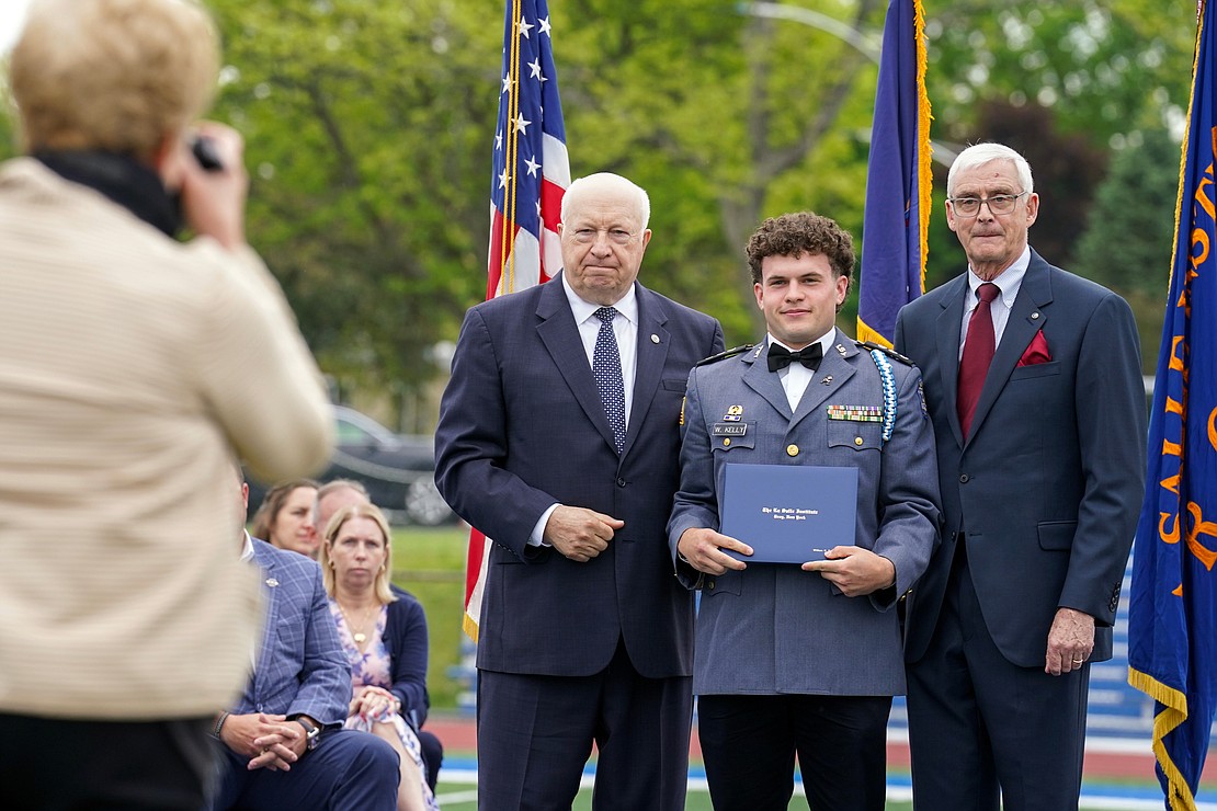 Graduate William Kelly III poses for a photo with out-going president Joseph Raczkowski, left, and commencement speaker Donald Reutemann during commencement exercises on Saturday May 18, 2024, at La Salle Institute in Troy, N.Y.  Cindy Schultz for The Evangelist