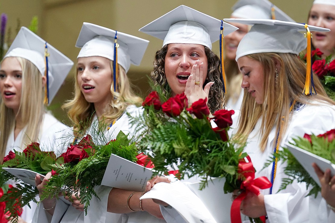 Graduate Isabella Cipollo, second from right, wipes away tears as her class sings their Alma Mater at the conclusion of commencement exercises on Friday May 24, 2024, at the Academy of the Holy Names in Albany, N.Y.  Cindy Schultz for The Evangelist