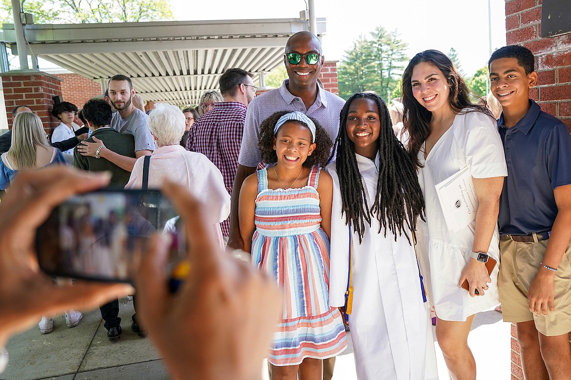 Graduate Jasmine Takyi, third from right, poses for a photo with family and friends after commencement exercises on Friday May 24, 2024, at the Academy of the Holy Names in Albany, N.Y.  Cindy Schultz for The Evangelist
