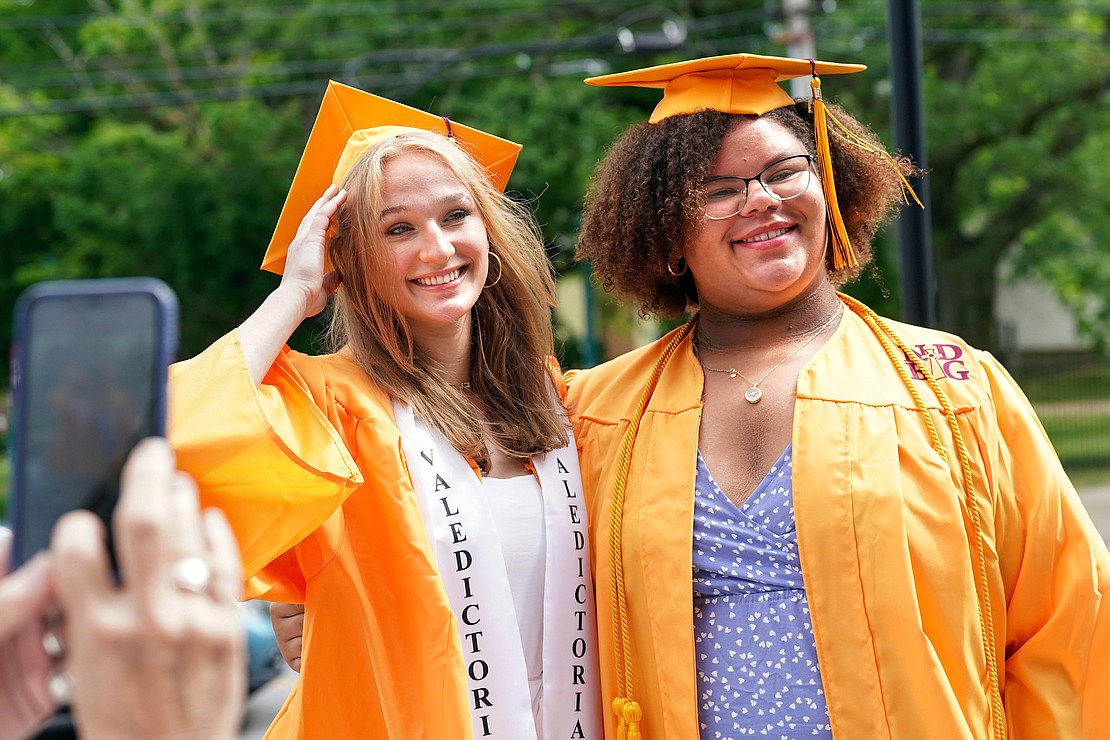 Valedictorian Tatum Liverio, left, and fellow graduate Alanah Kelly, who’s the daughter and granddaughter of NDBG alum, pose for pictures following Notre Dame – Bishop Gibbons commencement exercises on Saturday, June 8, 2024, at St. John the Evangelist Church in Schenectady, N.Y.  Cindy Schultz for The Evangelist