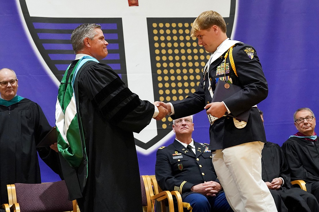 Graduate Nathan West, right, receives his diploma from Principal Charles Abba during commencement exercises on Friday, May 31, 2024, at Christian Brothers Academy in Colonie, N.Y.  Cindy Schultz for The Evangelist