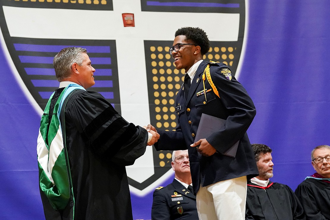 Graduate Aiden Wine, right, receives his diploma from Principal Charles Abba during commencement exercises on Friday, May 31, 2024, at Christian Brothers Academy in Colonie, N.Y.  Cindy Schultz for The Evangelist