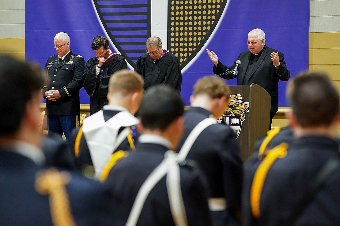 Father Bob Longobucco, right, delivers the benediction at the conclusion of commencement exercises on Friday, May 31, 2024, at Christian Brothers Academy in Colonie, N.Y.  Cindy Schultz for The Evangelist