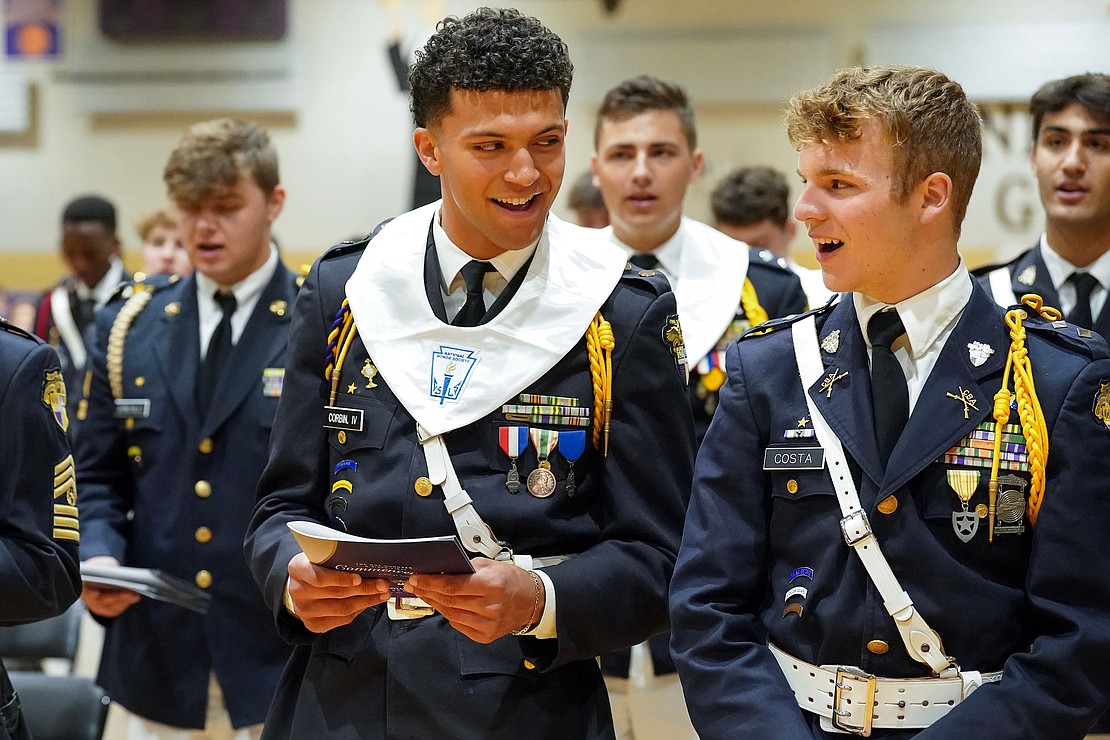 Graduates Edwin Corbin IV, left, and Adam Costa exchange a smile as they sing the school’s alma mater at the conclusion of commencement exercises on Friday, May 31, 2024, at Christian Brothers Academy in Colonie, N.Y.  Cindy Schultz for The Evangelist